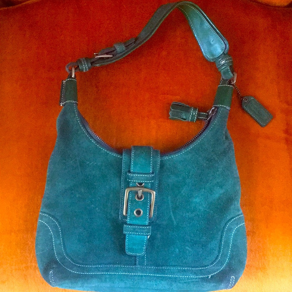 Green suede Coach bag.